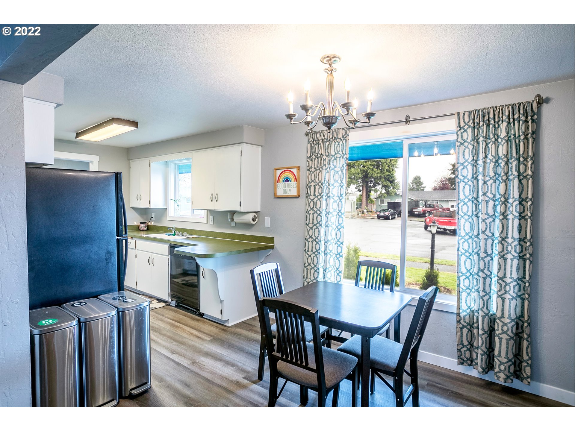 450 South 39th Place Springfield, OR 97478 - Photo 10 of 28 a view of a dining room with furniture and chandelier