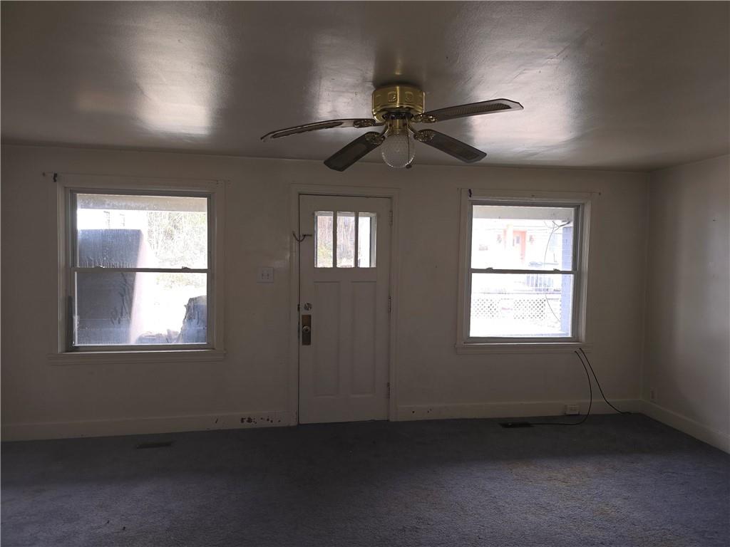 320 Main Street Fayette City, PA 15438 - Photo 13 of 28 an empty room with windows and fan