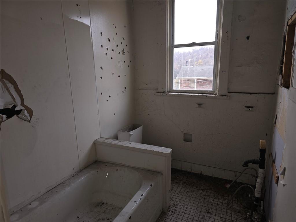 320 Main Street Fayette City, PA 15438 - Photo 16 of 28 a bathroom with a tub sink and window
