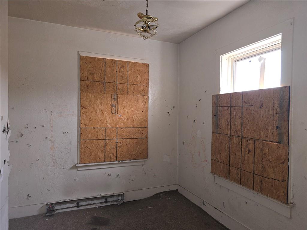 320 Main Street Fayette City, PA 15438 - Photo 19 of 28 an empty room with windows and entrance