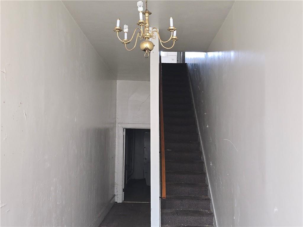 320 Main Street Fayette City, PA 15438 - Photo 3 of 28 a view of a hallway with wooden floor and staircase