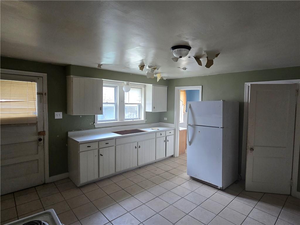 320 Main Street Fayette City, PA 15438 - Photo 7 of 28 a kitchen with a refrigerator and a sink