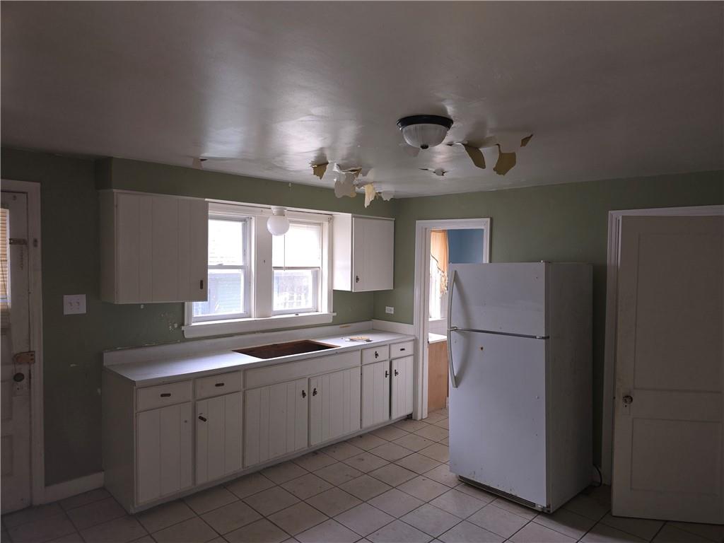 320 Main Street Fayette City, PA 15438 - Photo 8 of 28 a kitchen that has a sink a refrigerator and window