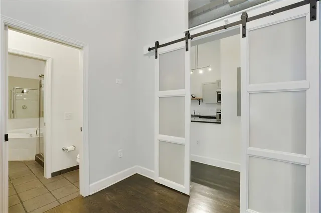 a bathroom with a shower and a glass door