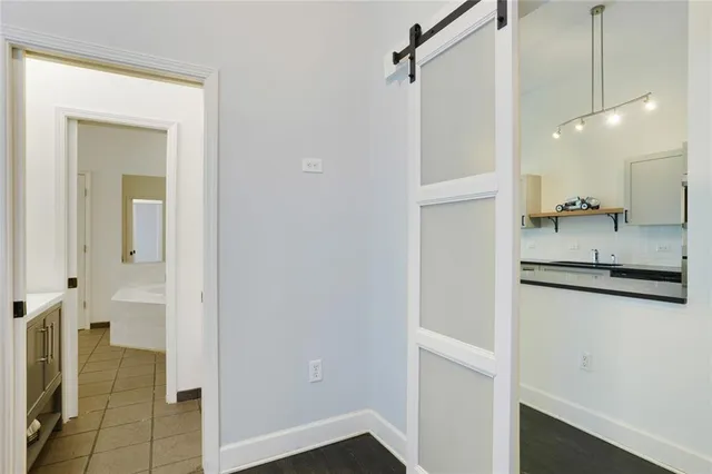 a bathroom with a shower and a sink