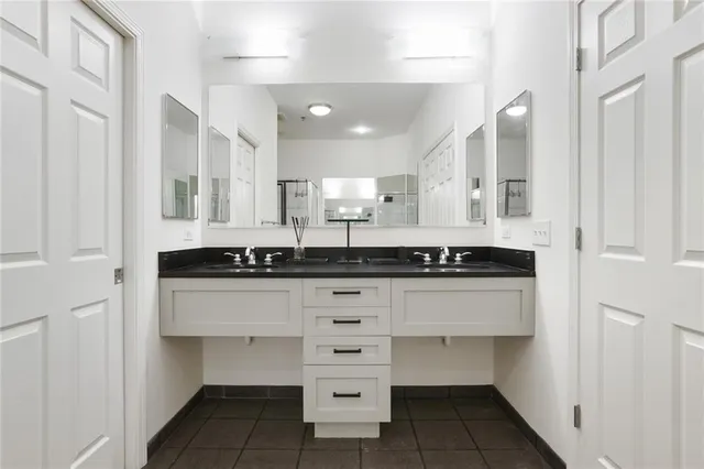a kitchen with stainless steel appliances a sink stove and cabinets