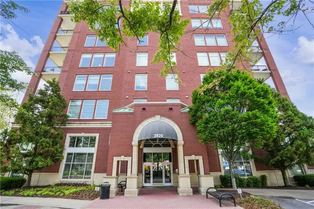 a front view of a multi story residential apartment buildings