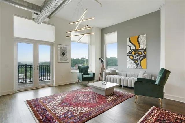 a living room with furniture and a rug