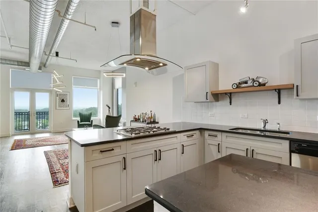 a kitchen with a sink cabinets and window