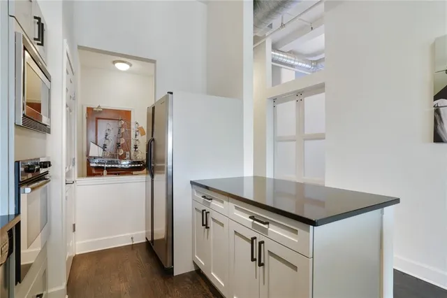 a view of a kitchen from the hallway