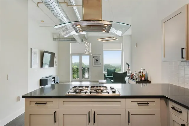 a kitchen with cabinets and window