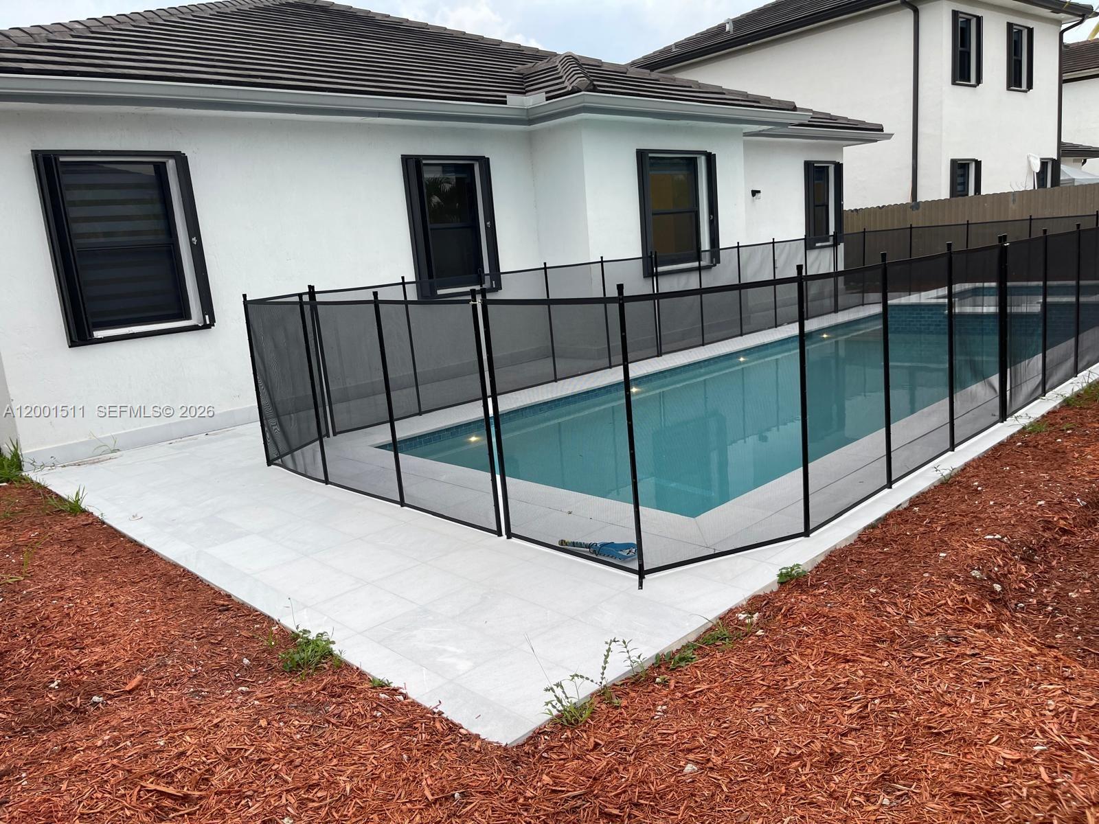 4451 Southwest 159th Path Miami, FL 33185 - Photo 18 of 24 a view of a house with backyard and porch