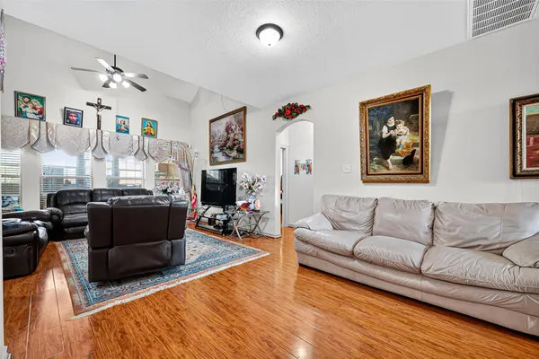 a living room with furniture and a flat screen tv