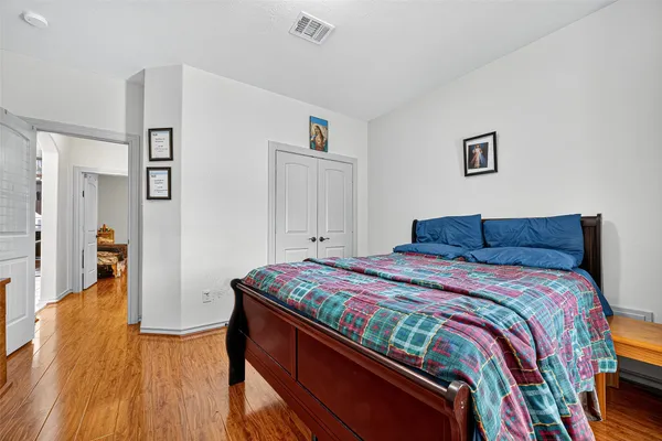 a bedroom with a bed and a dresser