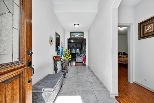a view of hallway with furniture and a window