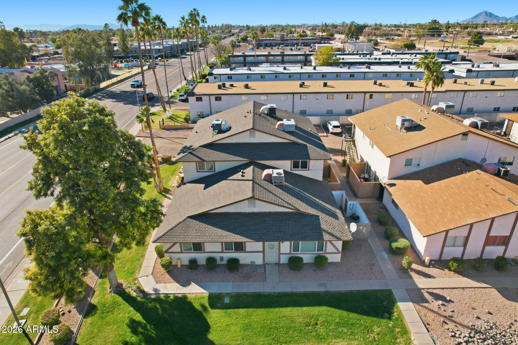 860 East Brown Road, Unit 29 Mesa, AZ 85203 - Photo 1 of 54 an aerial view of a house with swimming pool a yard and lake view