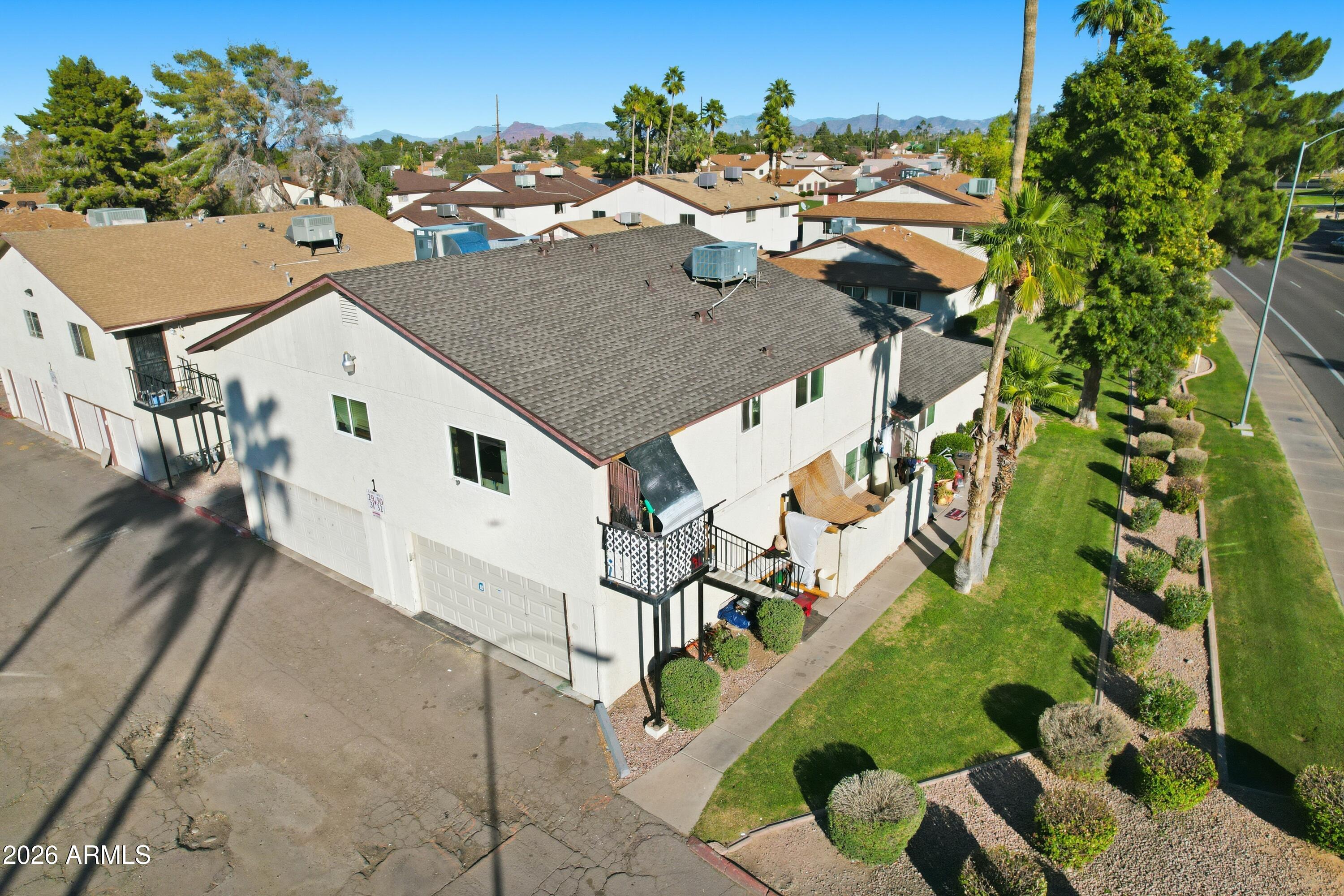 860 East Brown Road, Unit 29 Mesa, AZ 85203 - Photo 11 of 54 a aerial view of a house with a yard