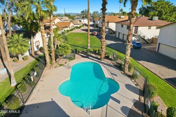 an aerial view of a house with a swimming pool