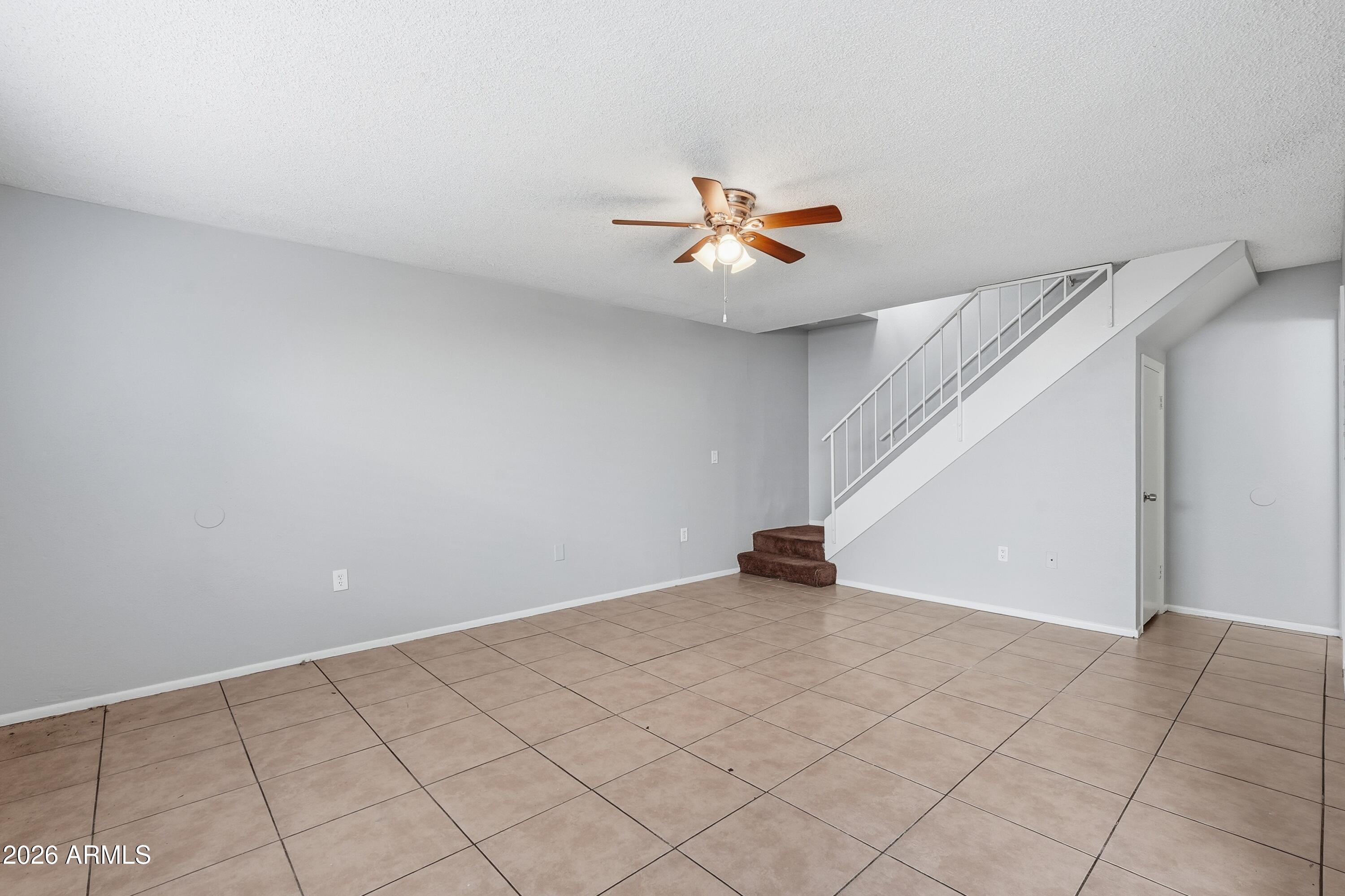 860 East Brown Road, Unit 29 Mesa, AZ 85203 - Photo 20 of 54 a view of an empty room with a window