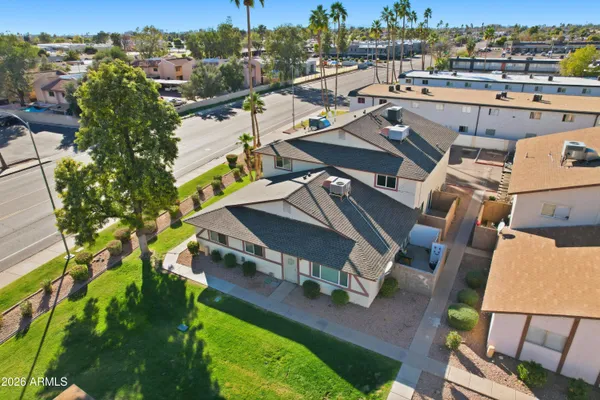 an aerial view of a house with a big yard