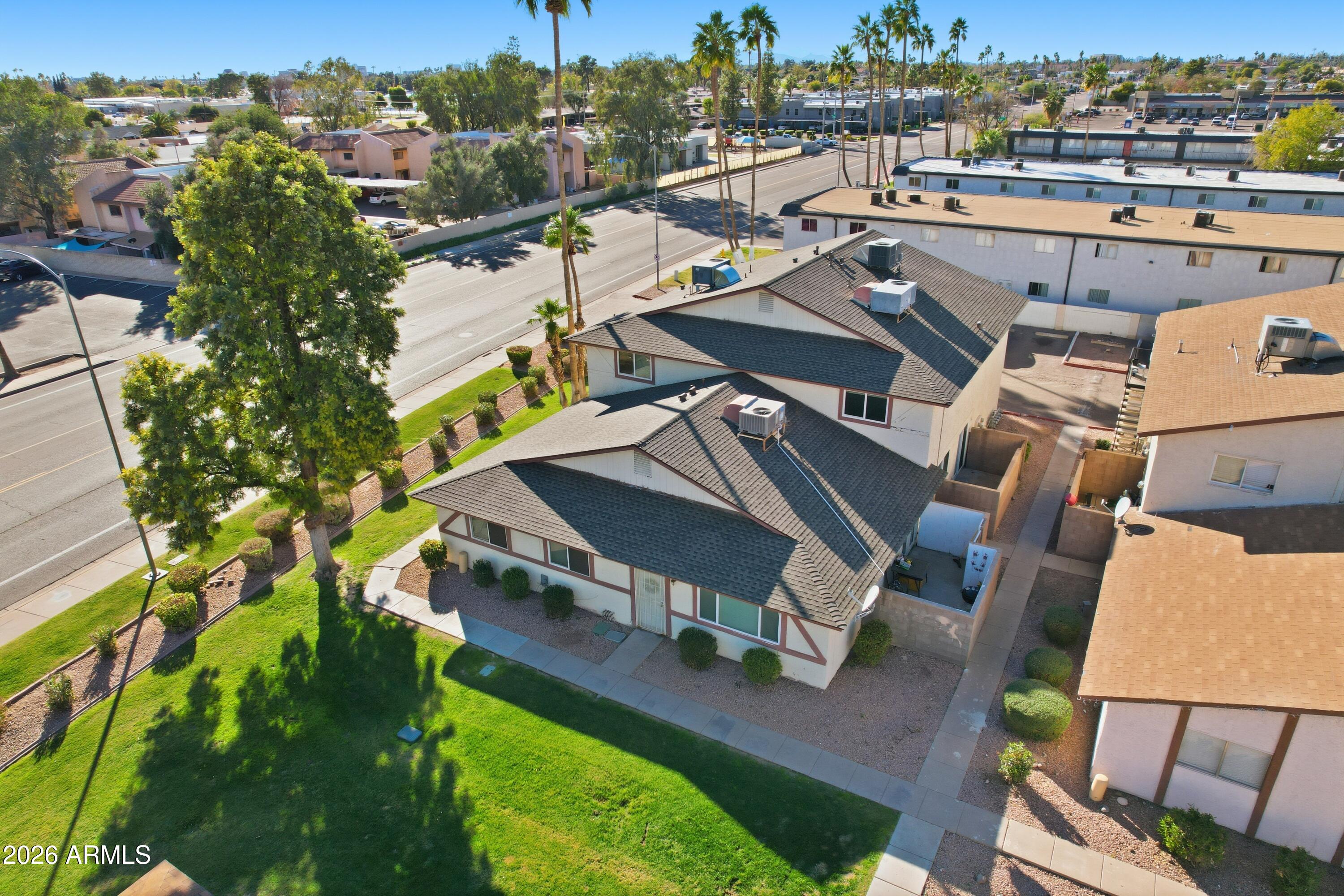 860 East Brown Road, Unit 29 Mesa, AZ 85203 - Photo 2 of 54 an aerial view of a house with a big yard