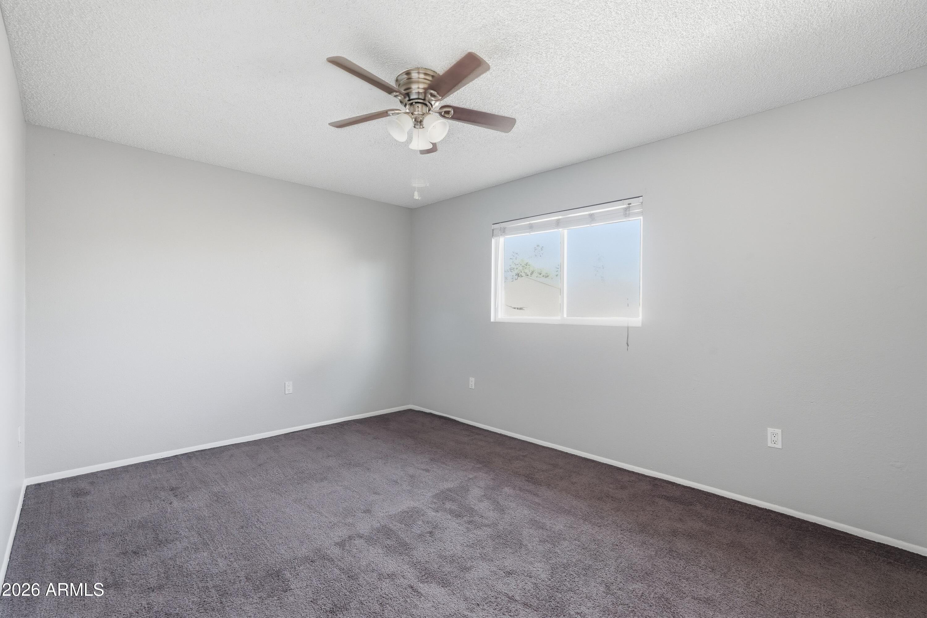 860 East Brown Road, Unit 29 Mesa, AZ 85203 - Photo 30 of 54 an empty room with a window