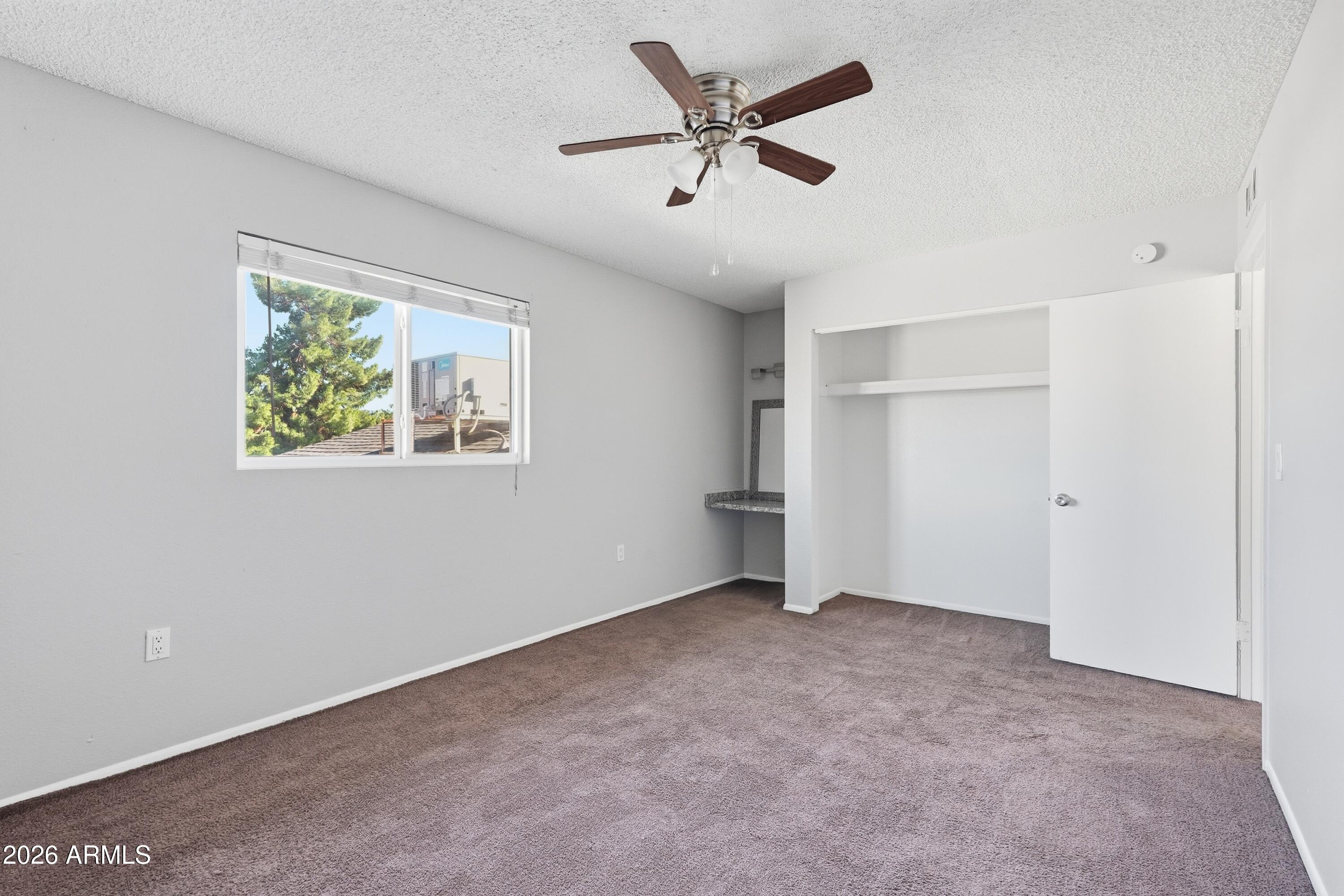 860 East Brown Road, Unit 29 Mesa, AZ 85203 - Photo 31 of 54 a view of an empty room with a window