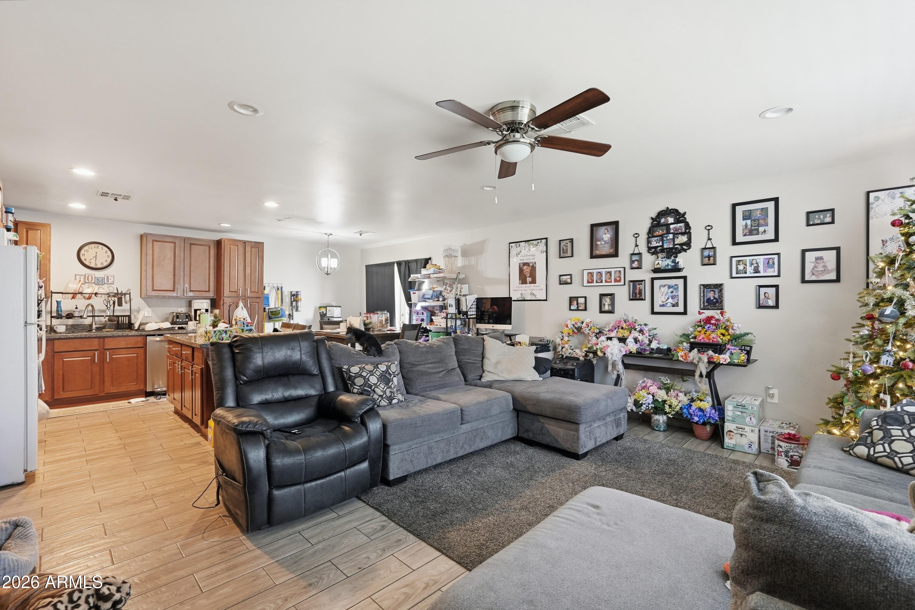 860 East Brown Road, Unit 29 Mesa, AZ 85203 - Photo 42 of 54 a living room with furniture kitchen view and a window