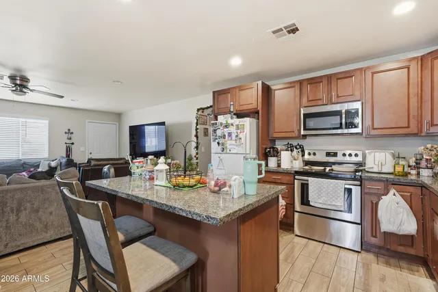 a bathroom with a sink toilet and mirror