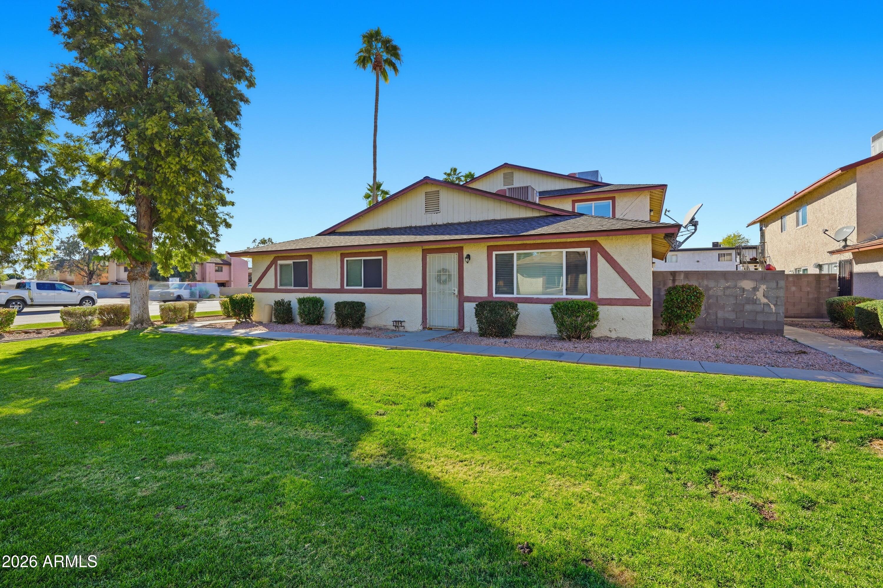 860 East Brown Road, Unit 29 Mesa, AZ 85203 - Photo 5 of 54 a front view of a house with garden