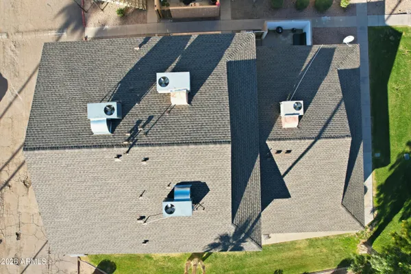an aerial view of residential houses with outdoor space