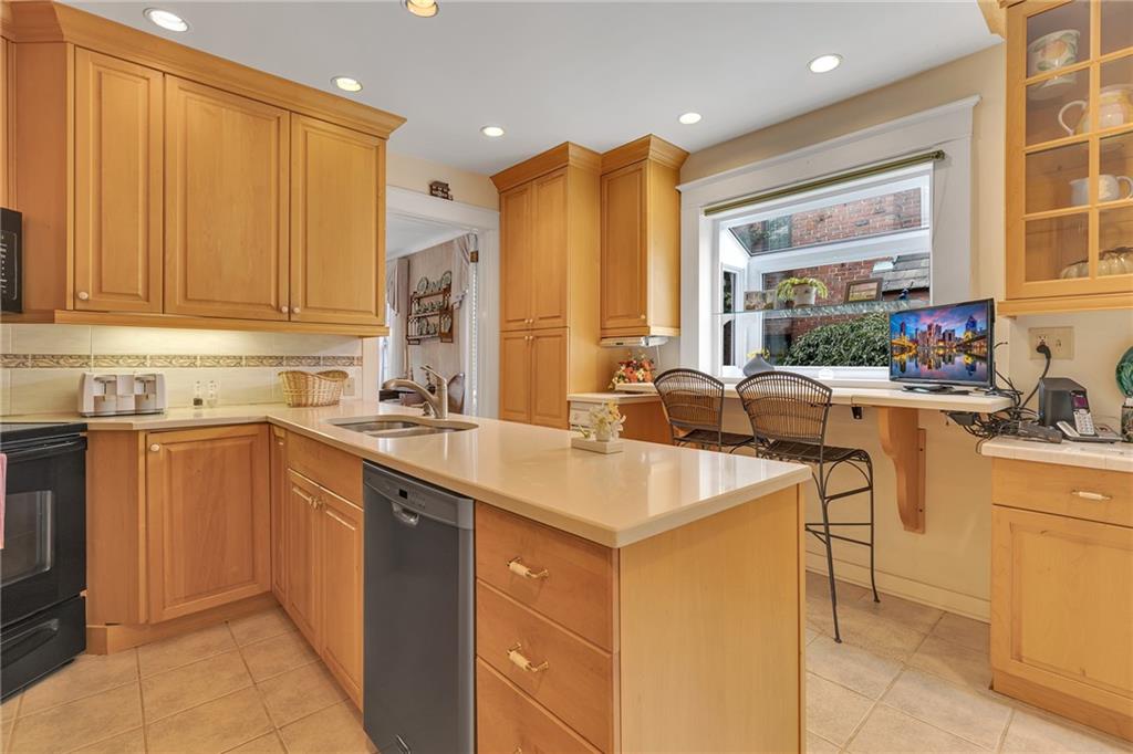 1020 River Road Beaver, PA 15009 - Photo 19 of 42 a kitchen with sink a window and chairs