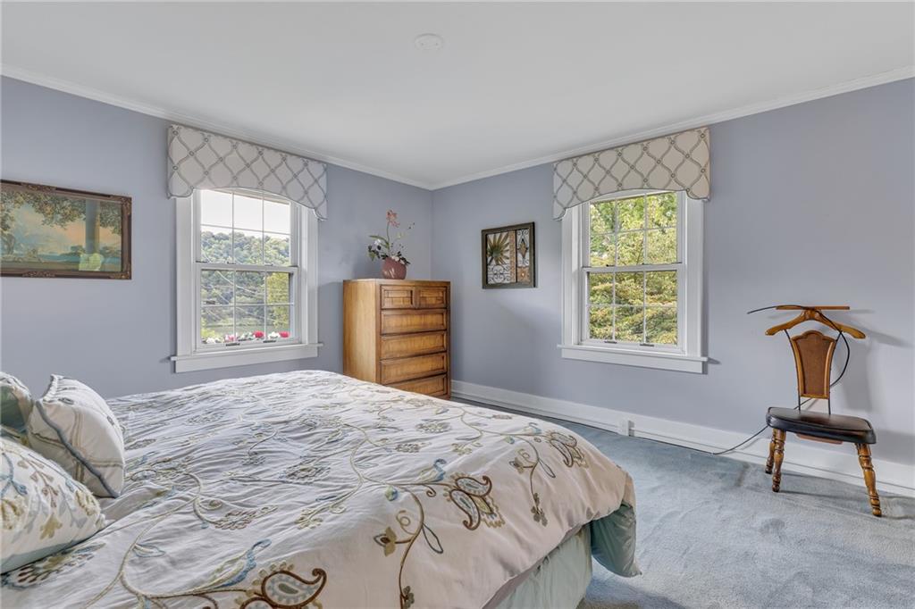 1020 River Road Beaver, PA 15009 - Photo 27 of 42 a bedroom with a bed and a window