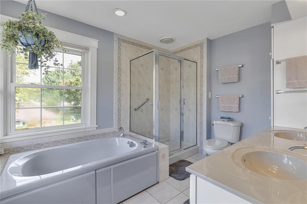 1020 River Road Beaver, PA 15009 - Photo 28 of 42 a bathroom with a tub sink and mirror