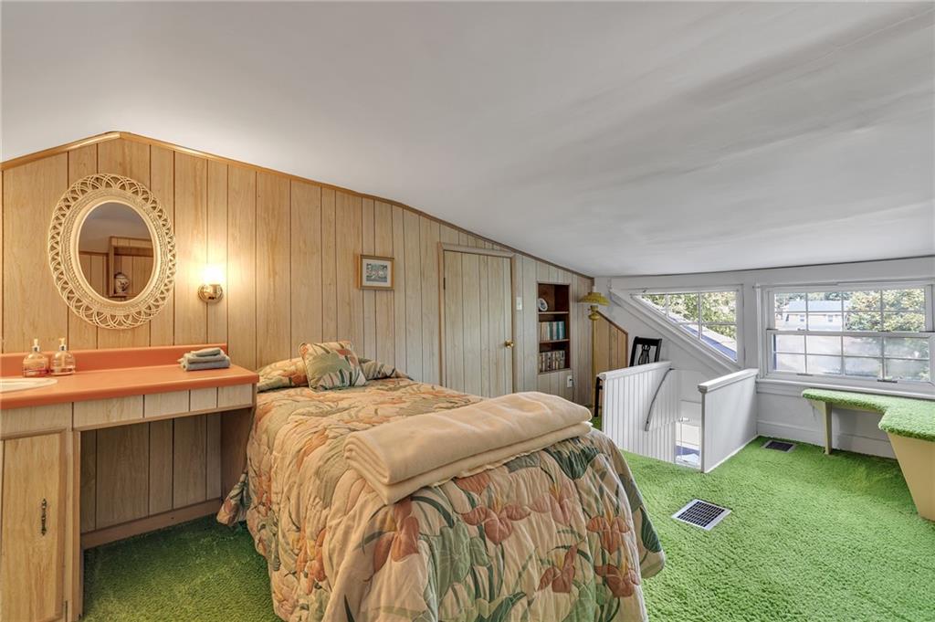 1020 River Road Beaver, PA 15009 - Photo 38 of 42 a bedroom with a bed a mirror and a window