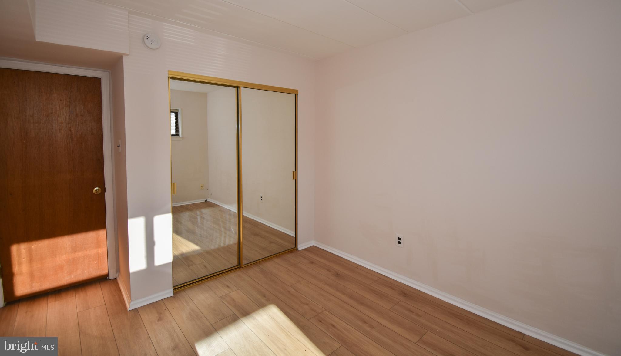 6-1 Aspen Way Doylestown, PA 18901 - Photo 15 of 19 a view of empty room with wooden floor