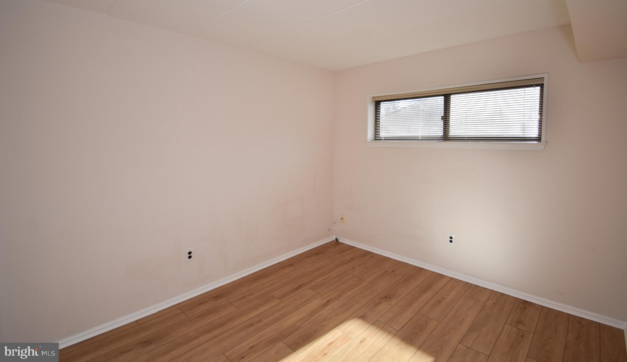 6-1 Aspen Way Doylestown, PA 18901 - Photo 16 of 19 a view of a room that has wooden floor and white walls