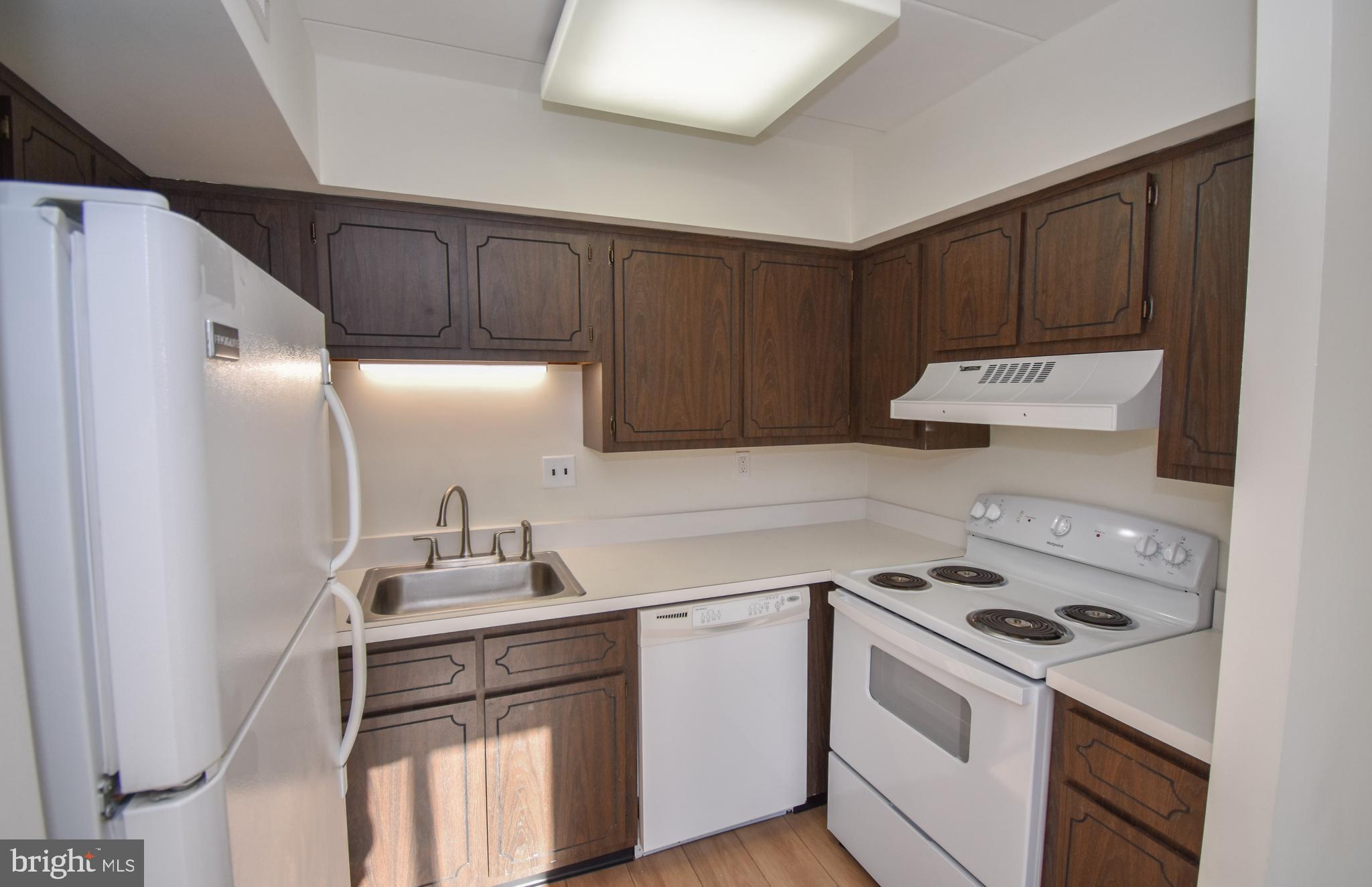 6-1 Aspen Way Doylestown, PA 18901 - Photo 7 of 19 a kitchen with a sink a stove and refrigerator