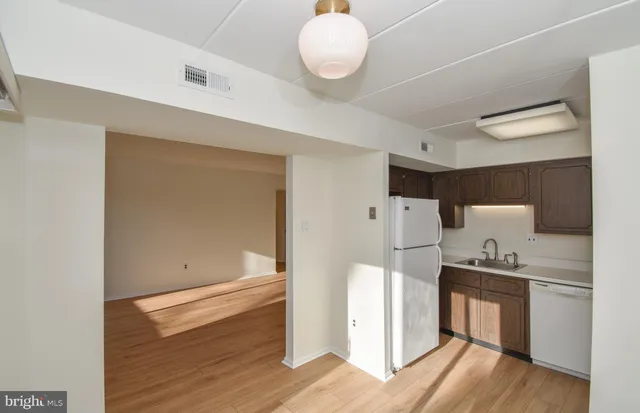 a kitchen with a refrigerator and countertop