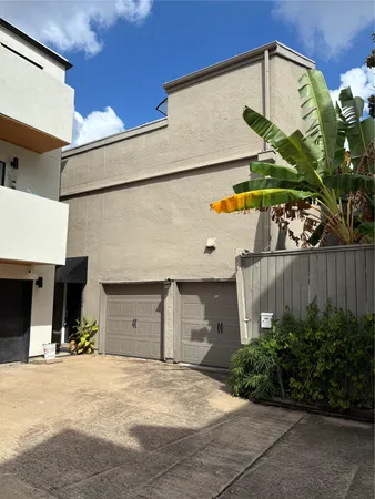 a front view of a house with a garage