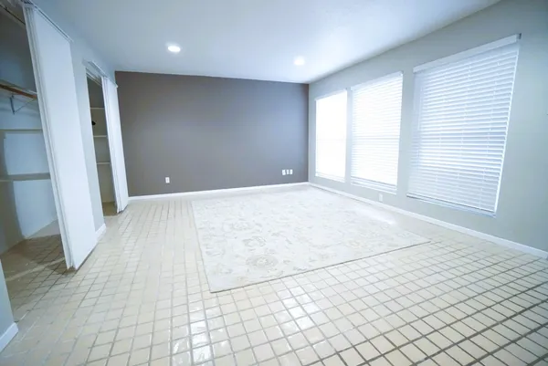 a bathroom that has a glass shower door