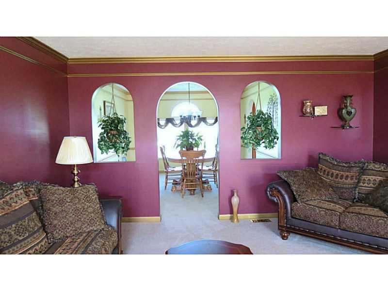 126 Lentz Road Latrobe, PA 15650 - Photo 11 of 25 Living Room. LR with gold crown molding, trim and archway windows.