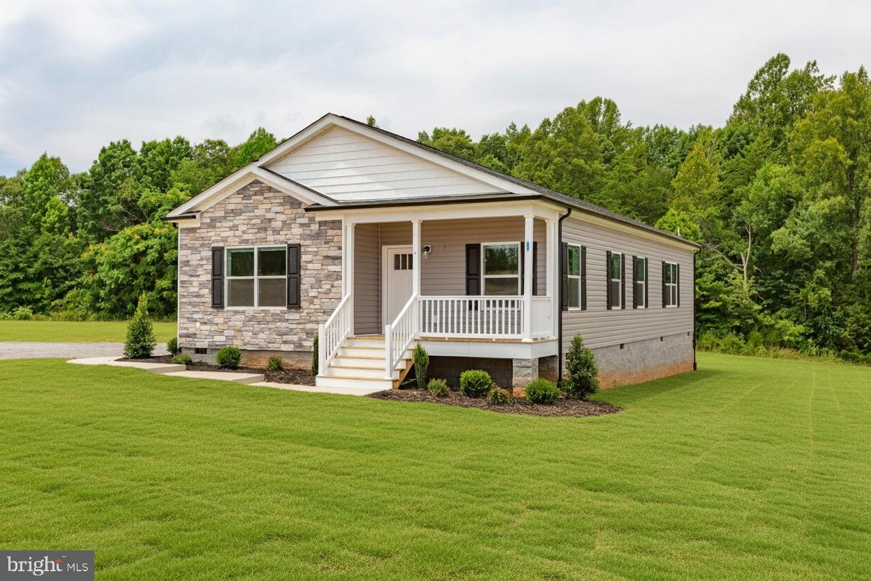 967 Levi Road Green Bay, VA 23942 - Photo 2 of 39 a front view of a house with a garden