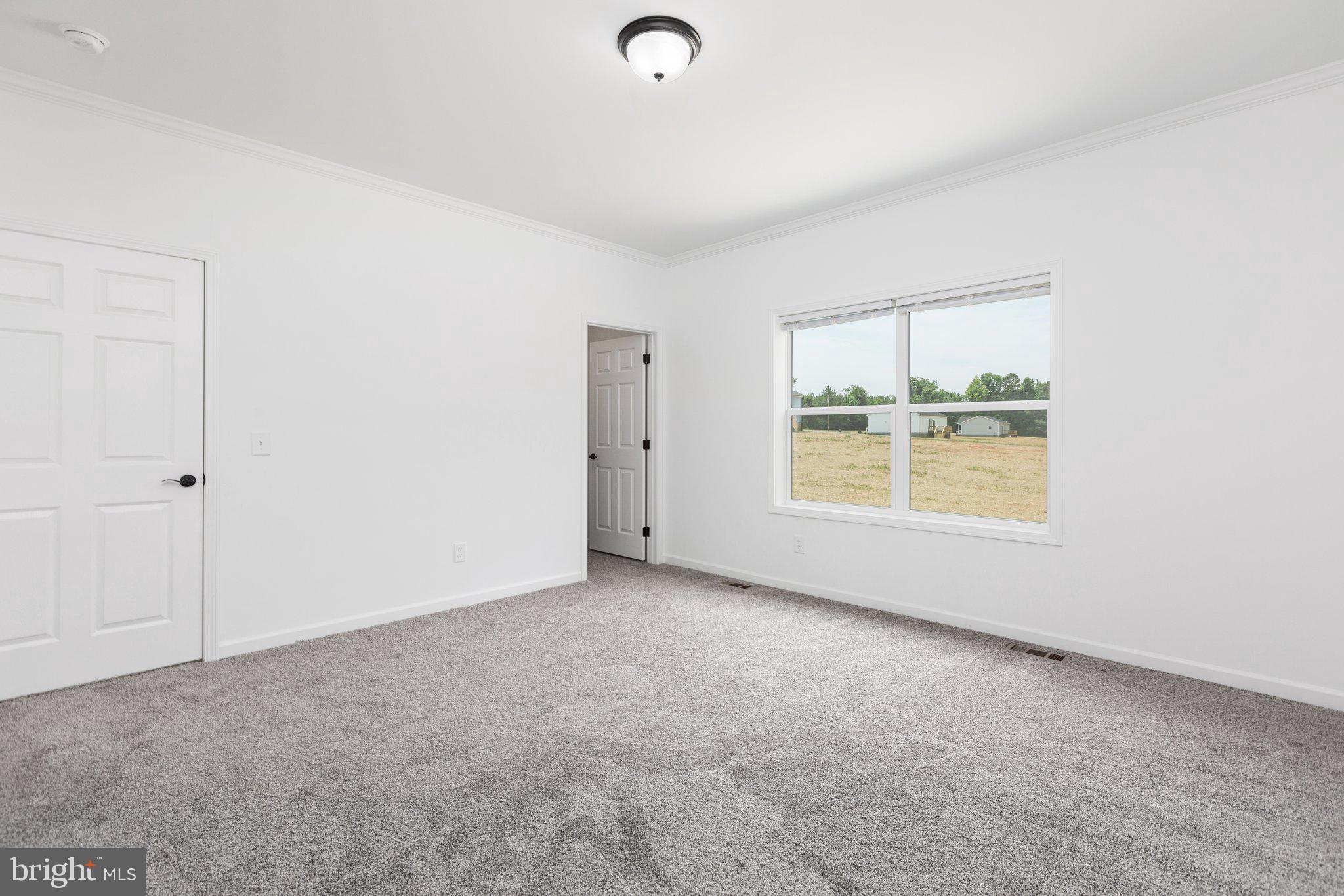 967 Levi Road Green Bay, VA 23942 - Photo 25 of 39 an empty room with windows