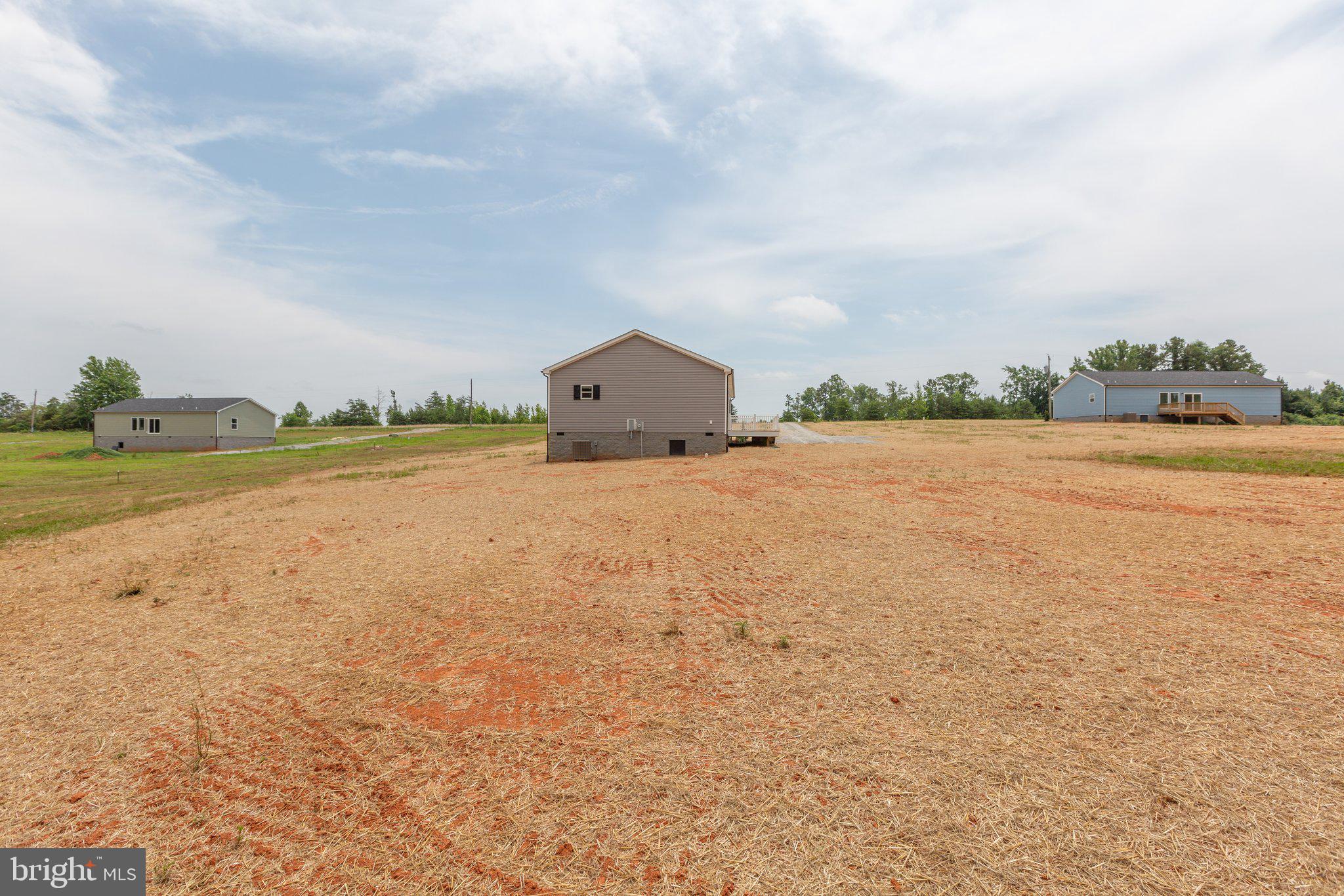 967 Levi Road Green Bay, VA 23942 - Photo 34 of 39 a view of an ocean beach and a yard