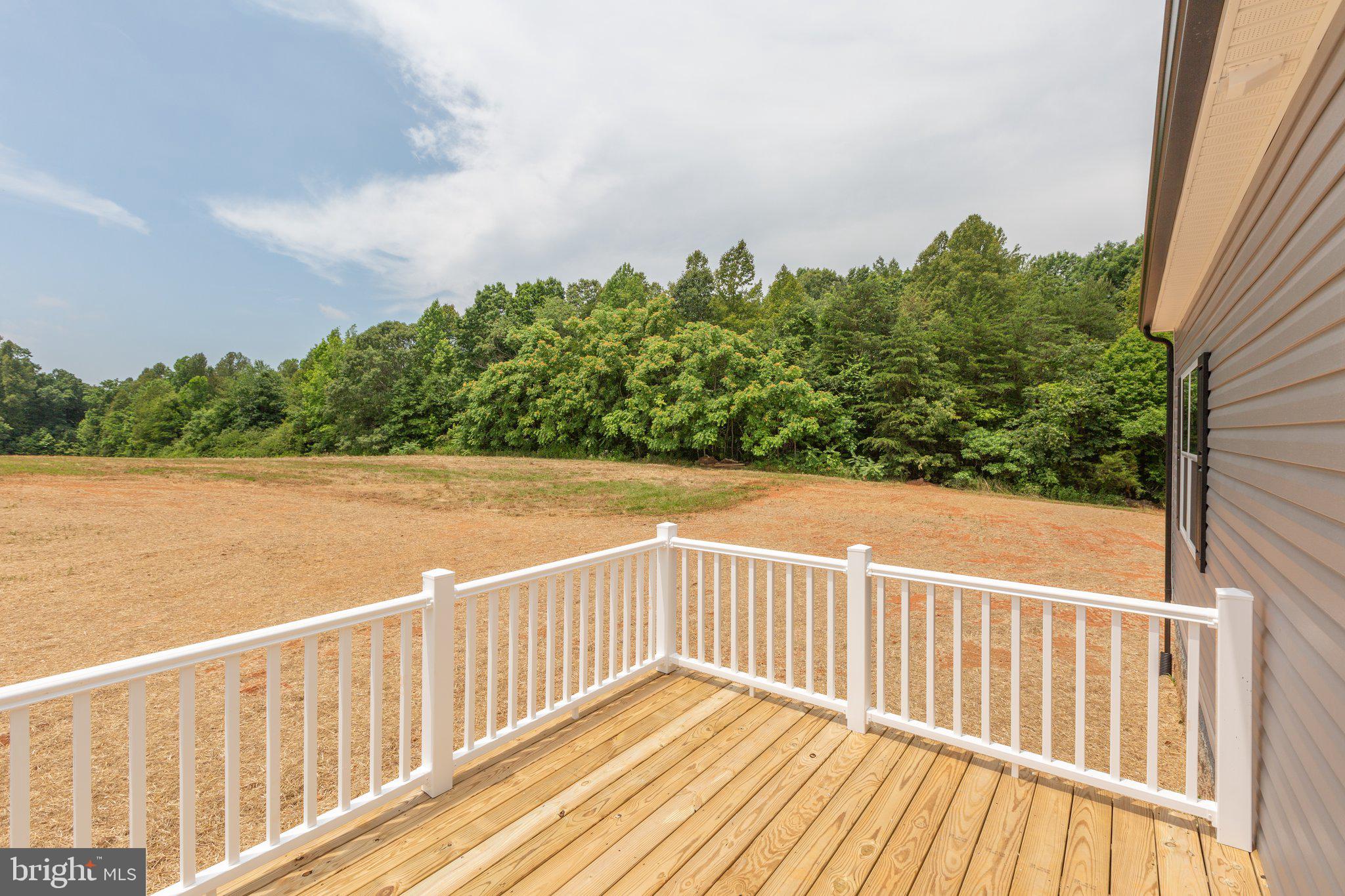 967 Levi Road Green Bay, VA 23942 - Photo 37 of 39 a view of a balcony with wooden floor and fence