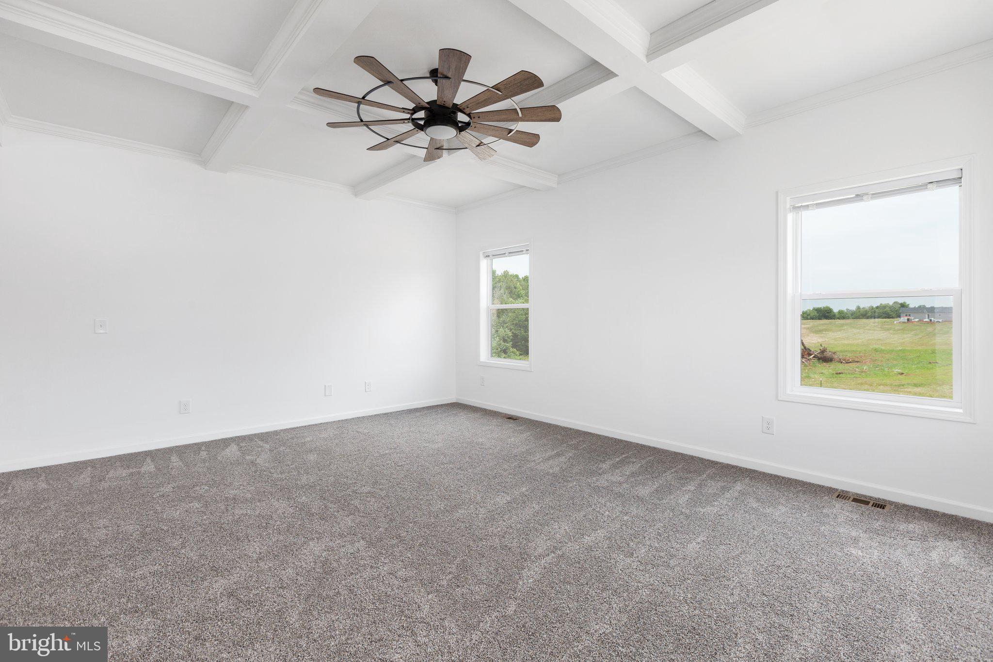 967 Levi Road Green Bay, VA 23942 - Photo 5 of 39 an empty room with a window and a fan
