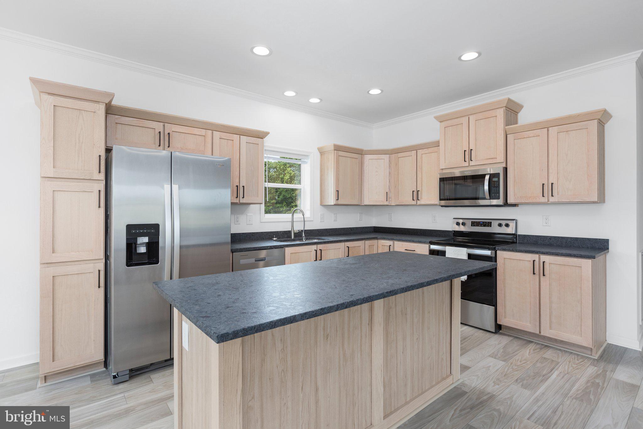 967 Levi Road Green Bay, VA 23942 - Photo 10 of 39 a kitchen with stainless steel appliances granite countertop a sink a stove a refrigerator and a microwave