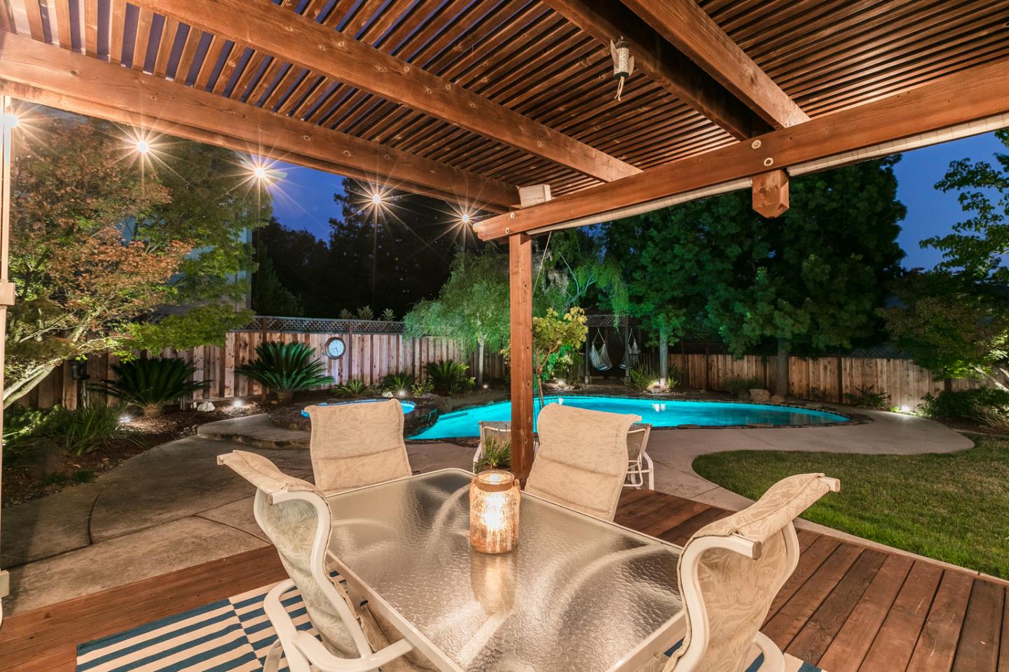 757 Harry Road San Jose, CA 95120 - Photo 11 of 60 a view of a patio with table and chairs potted plants with wooden floor and fence