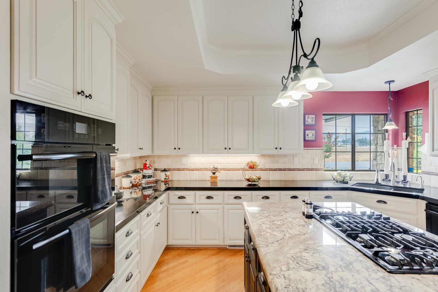 757 Harry Road San Jose, CA 95120 - Photo 23 of 60 a kitchen with stainless steel appliances kitchen island granite countertop a stove sink and cabinets
